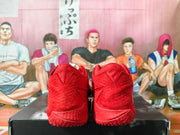 Rear view of the red shoes showing the heel and outsole details