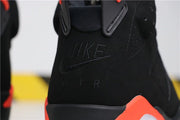 Close-up of the tongue showing embroidered Nike Air branding in black.