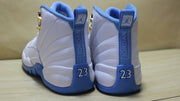 Rear three-quarter view showing the heel tabs, blue outsole, and 23 details.