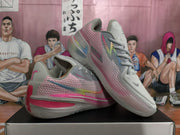 Pair of gray and pink Nike GT sneakers displayed from angled side and top views.