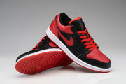 Angled view of the pair showing red laces, perforated toe boxes, white midsoles, and red outsoles.