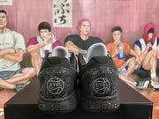 Rear view showing EYBL heel graphics and speckled black midsoles.