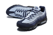 Pair of Nike Air Max 95 sneakers in navy and light blue, shown from above at an angle.