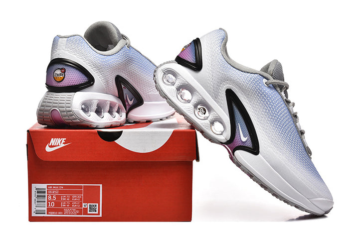 Nike Air Max DN sneakers in white and light blue displayed with a Nike shoebox.