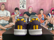Rear view of purple basketball shoes with yellow heel accents and white midsoles