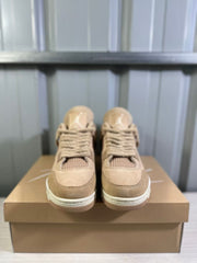 Front view of the pair showing the tan toe boxes, laces, tongues, and textured outsoles.