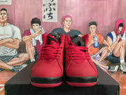 Front view of red lace-up high-top sneakers with black trim