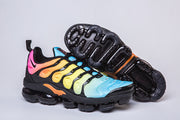Nike Air VaporMax Plus sneaker beside a view of its outsole