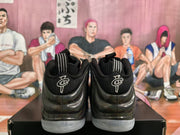 Rear view of the pair showing black padded collars, striped pull tabs and embroidered Penny-inspired heel emblems.