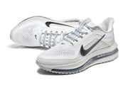 Pair of white and silver Nike Pegasus Premium shoes in a three-quarter view.