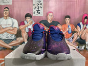 Front view of dark galaxy-print Nike basketball shoes with navy laces and purple accents.