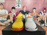 Front view of the mismatched pair, showing yellow and blue on one shoe and white and green on the other.