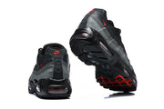 Rear and outsole views of black and grey Nike Air Max 95 sneakers with red accents.