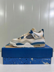 Side profile of a white and blue Jordan Air Jordan 4 Retro sneaker resting on its shoebox.
