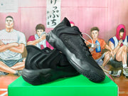 Angled view of black Nike sneakers showing the side Swoosh and sculpted sole.