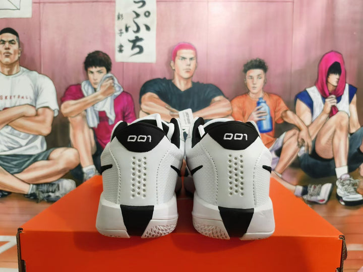 Rear view of white and black Nike basketball shoes with perforated heel panels