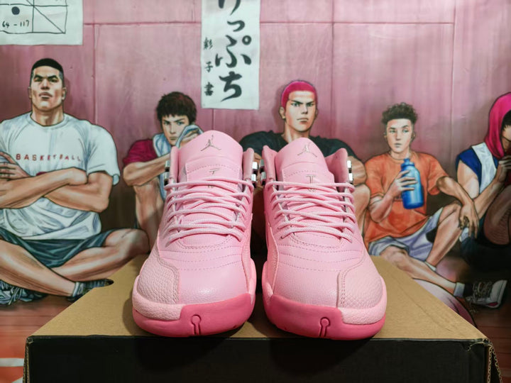 Front view of pink high-top basketball sneakers displayed on a black shoebox.