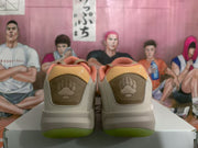 Rear view of the Jordan sneakers showing brown heel panels, embroidered paw-print details, and translucent green outsole sections.