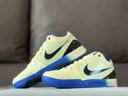 Two sneakers arranged together to show the side panels, black heel sections and blue outsole details.