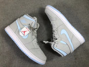 Top-down view of the pair showing the gray panels, pale blue Swooshes, perforated toe boxes, and contrasting outsoles.