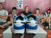 Rear view showing the blue heel sections, white midsoles, and padded blue collar lining.