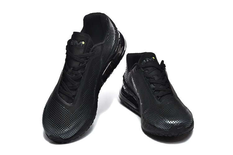 Pair of black low-top Nike Air Max sneakers, shown from the front.
