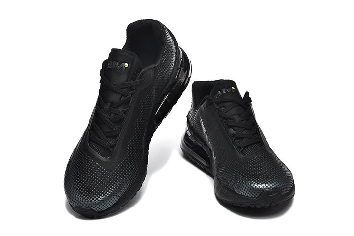 Pair of black low-top Nike Air Max sneakers, shown from the front.
