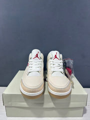 Front view of the pair showing white laces, perforated tongue panels, and red Jumpman logos.