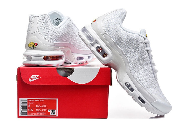 White Nike Air Max Plus VI sneakers with a red Nike shoe box; the box label shows a sample size.