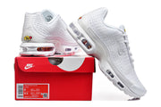 White Nike Air Max Plus VI sneakers with a red Nike shoe box; the box label shows a sample size.