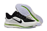 Nike Pegasus Premium shoes showing the black and white upper, green midsole section, and patterned outsole.