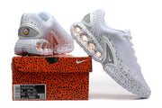 Nike Air Max DN SE PRM sneakers beside a box whose label shows size 8 and 9.5.
