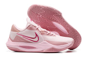 Pale pink basketball shoe with deeper pink accents and a matching outsole.
