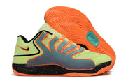 Lime and orange Nike KD 18 sneaker with a bright orange patterned outsole.