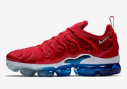 Opposite side profile of the red sneaker showing its side cage and heel logo.