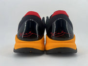Rear view of the pair, showing black heel panels with red signature-style graphics.