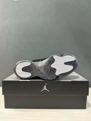 Bottom view of the sneaker showing the translucent gray outsole and white-and-gray traction pattern.