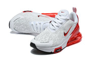 Top and angled views of white and red Nike Air Max 270 Premium sneakers.