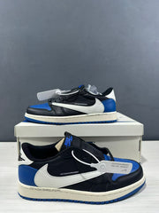 Close side view highlighting the white Swoosh, black panels, blue heel, and printed midsole detail.
