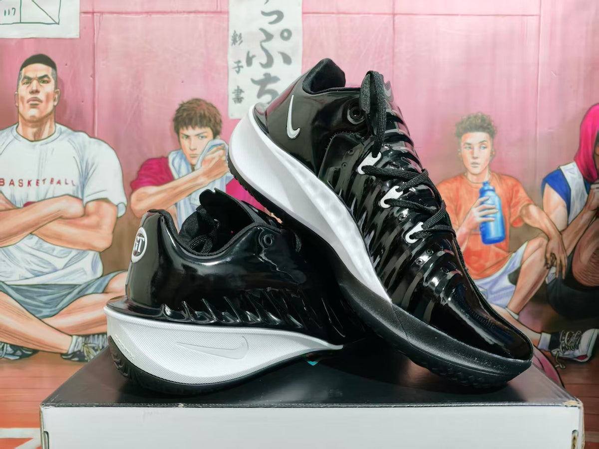 Black and white Nike GT basketball shoes shown at an angle