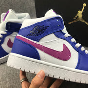Close-up of the blue collar, winged branding, pink side swoosh, and white stitching