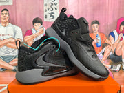 Angled view of black and grey Nike basketball sneakers showing the patterned upper, side branding, laces, padded collars and grey midsoles.