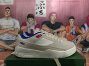 Side view showing the off-white upper, textured side panel, blue collar lining, and white rubber sole.