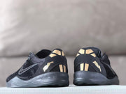 Rear view of the pair showing gold-tone heel accents