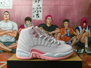 Side view of a white and pink Jordan high-top sneaker showing stitched panels and textured side detailing.