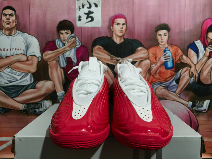 White and red Adidas Harden basketball shoes shown from the front