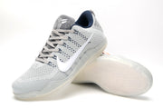 Angled view of gray Nike Kobe 11 shoes showing the laces, tongue logo, and sole