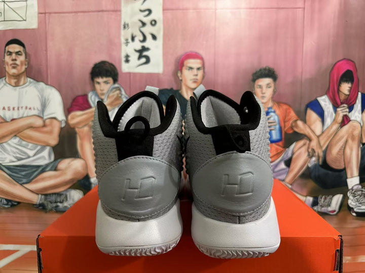 Rear view of grey and black Nike basketball shoes with textured panels and white outsoles