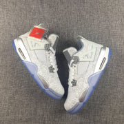 Pair of white and platinum Jordan Air Jordan 4 sneakers shown from an angled overhead view with translucent blue outsoles.