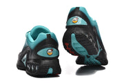 Nike Air Max DN sneakers viewed from the rear, showing turquoise heel details and black soles.